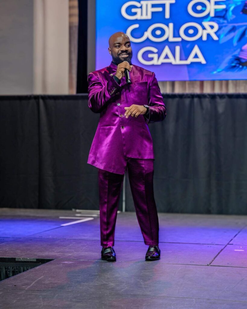 Brandon Calloway in a purple silk suit at the gift of color gala