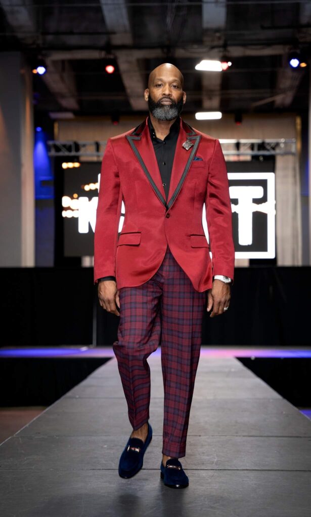 Alejandro Rey Williams wearing a Wine and Plaid Sean M Horton Atelier custom suit