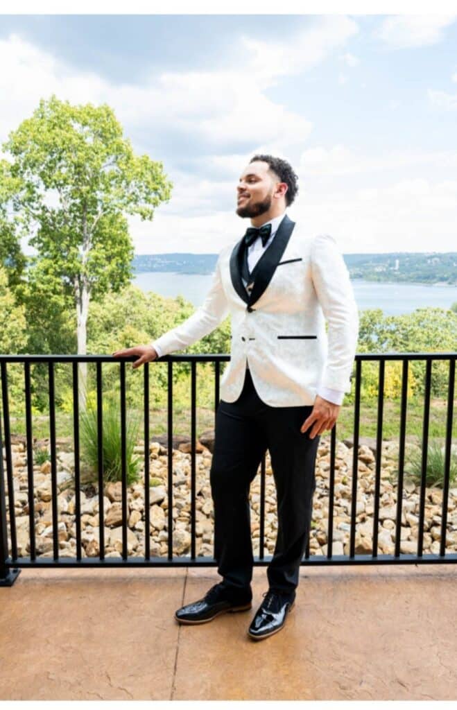 Man wearing a white and black Sean M Horton Atelier custom tuxedo